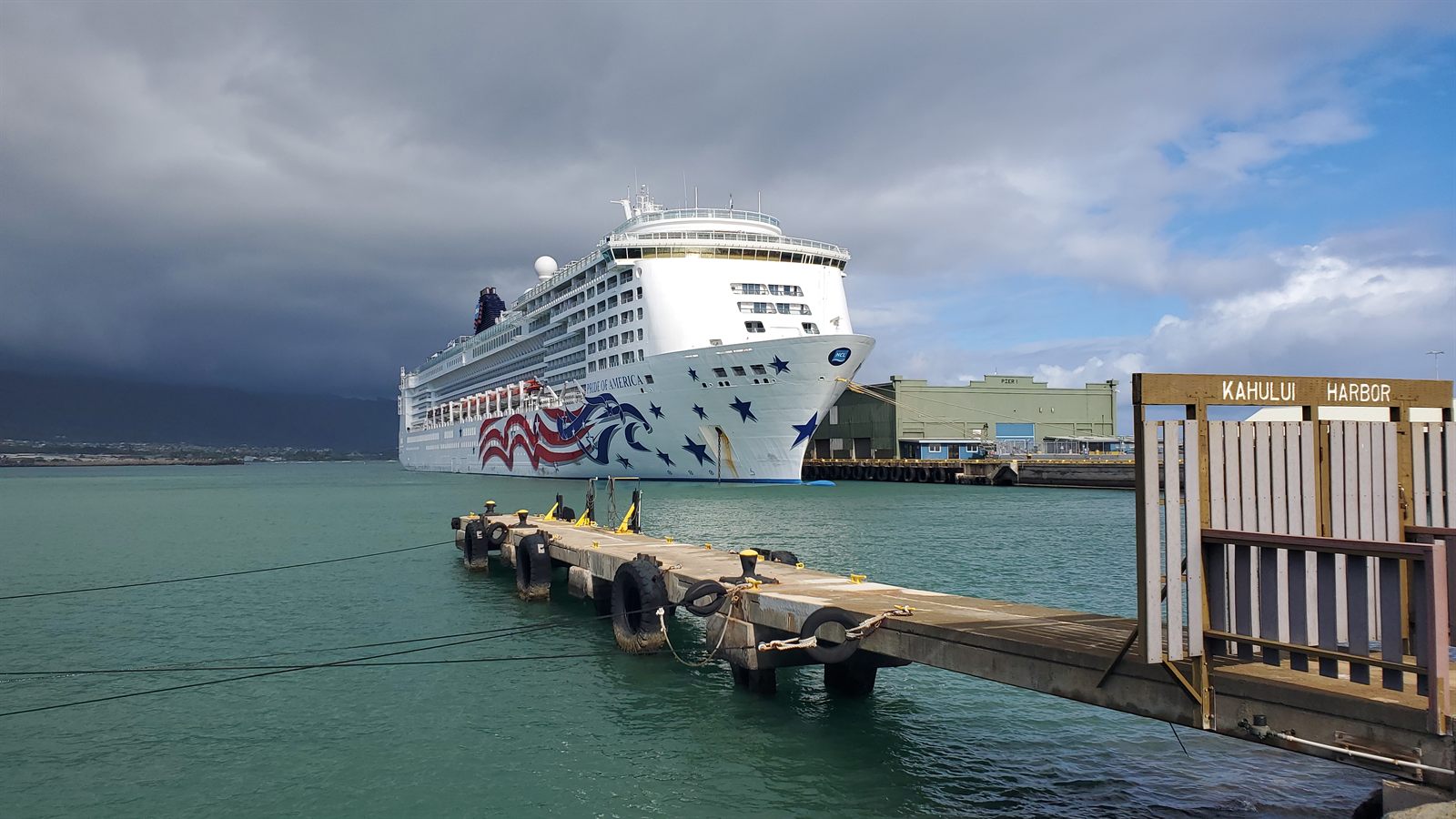 Pride of America docked at Kahului Harbor on Maui under storm clouds